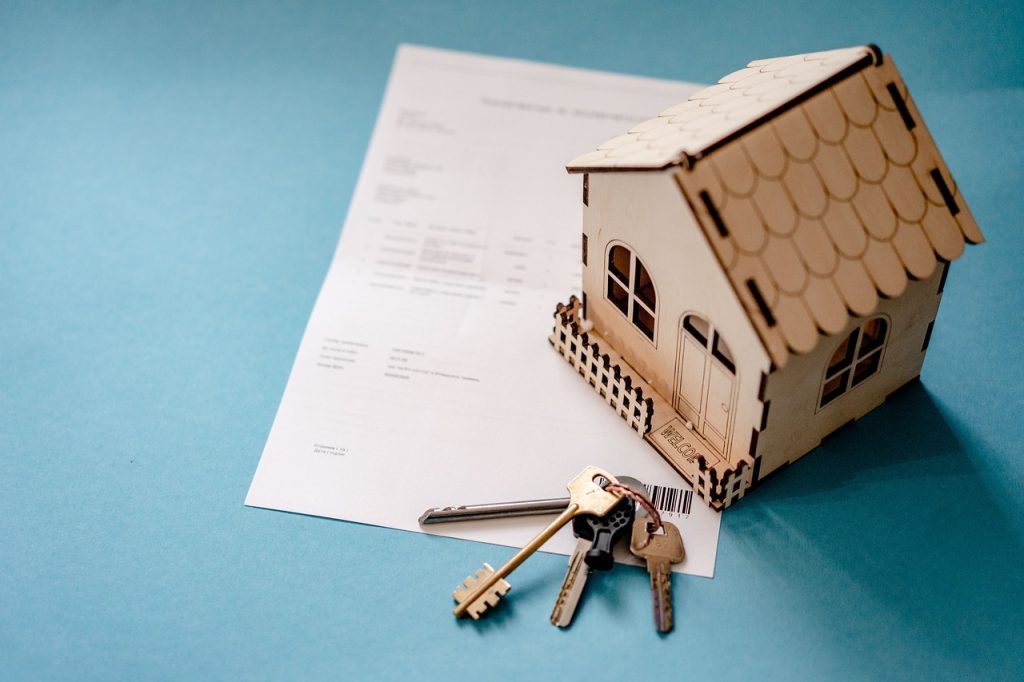 Investors reviewing property deal paperwork together